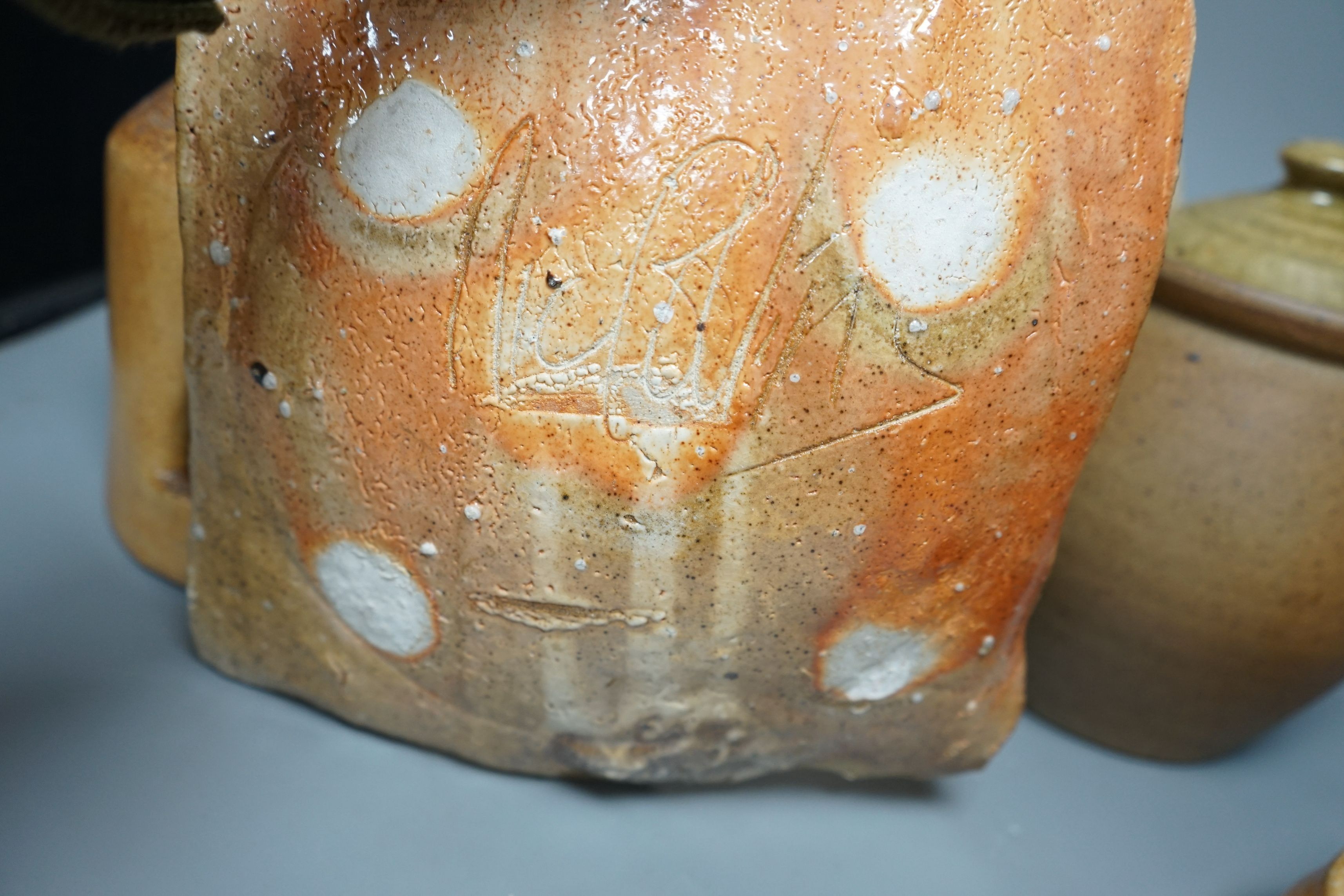 British studio pottery; a group to include a Micki Schloessingk (b.1949) salt glaze teapot and cover, together with other similar items and other studio pottery wares, largest 39cm wide, (5)